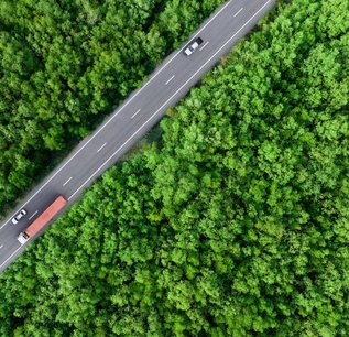 bigstock-Aerial-Top-View-Of-Car-And-Tru-476638011-scaled