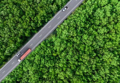 bigstock-Aerial-Top-View-Of-Car-And-Tru-476638011-scaled