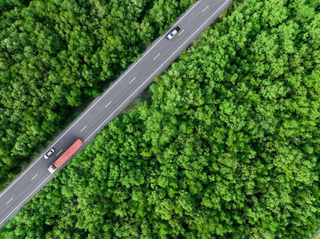 bigstock-Aerial-Top-View-Of-Car-And-Tru-476638011-scaled