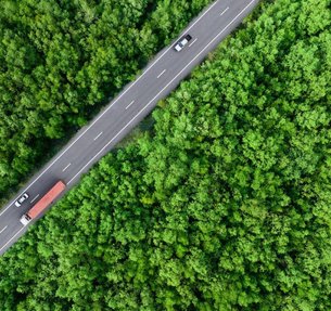 bigstock-Aerial-Top-View-Of-Car-And-Tru-476638011-scaled